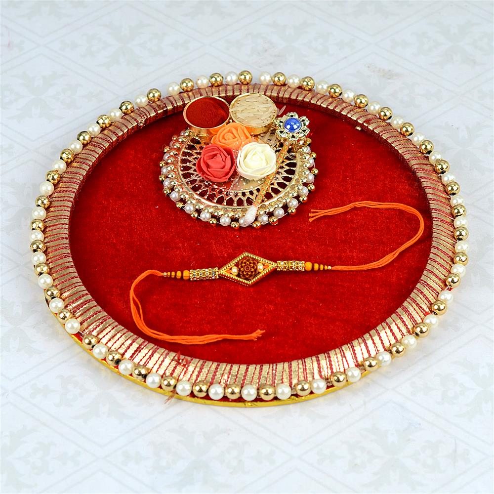 Orange Diamond Rakhi With Roli Chawal on Round Thali, Puja Thali on Rakhi